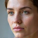 Image representing anti-aging skincare, perhaps a smooth, radiant face or a bottle with a 'youth' theme.